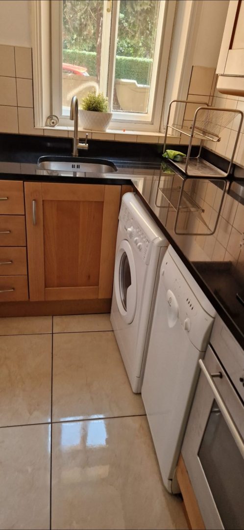 Clean kitchen with a shiny tiled floor in a Dublin home