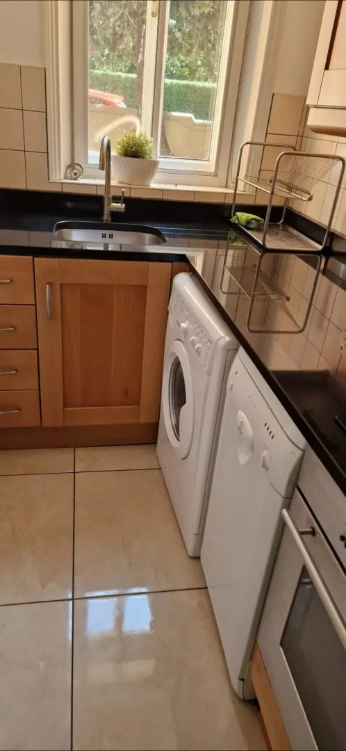 Clean kitchen with a shiny tiled floor after our cleaning services in Dublin