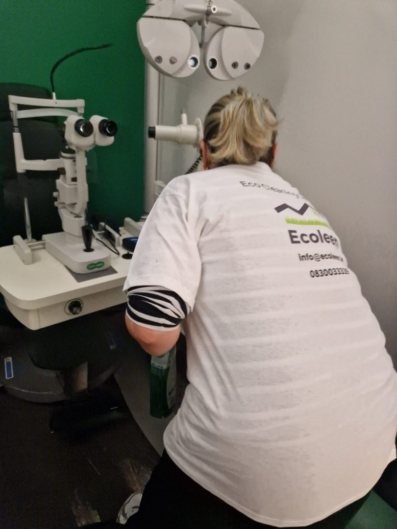 Ecoleen cleaner working around specialist equipment during a commercial clean in Dublin