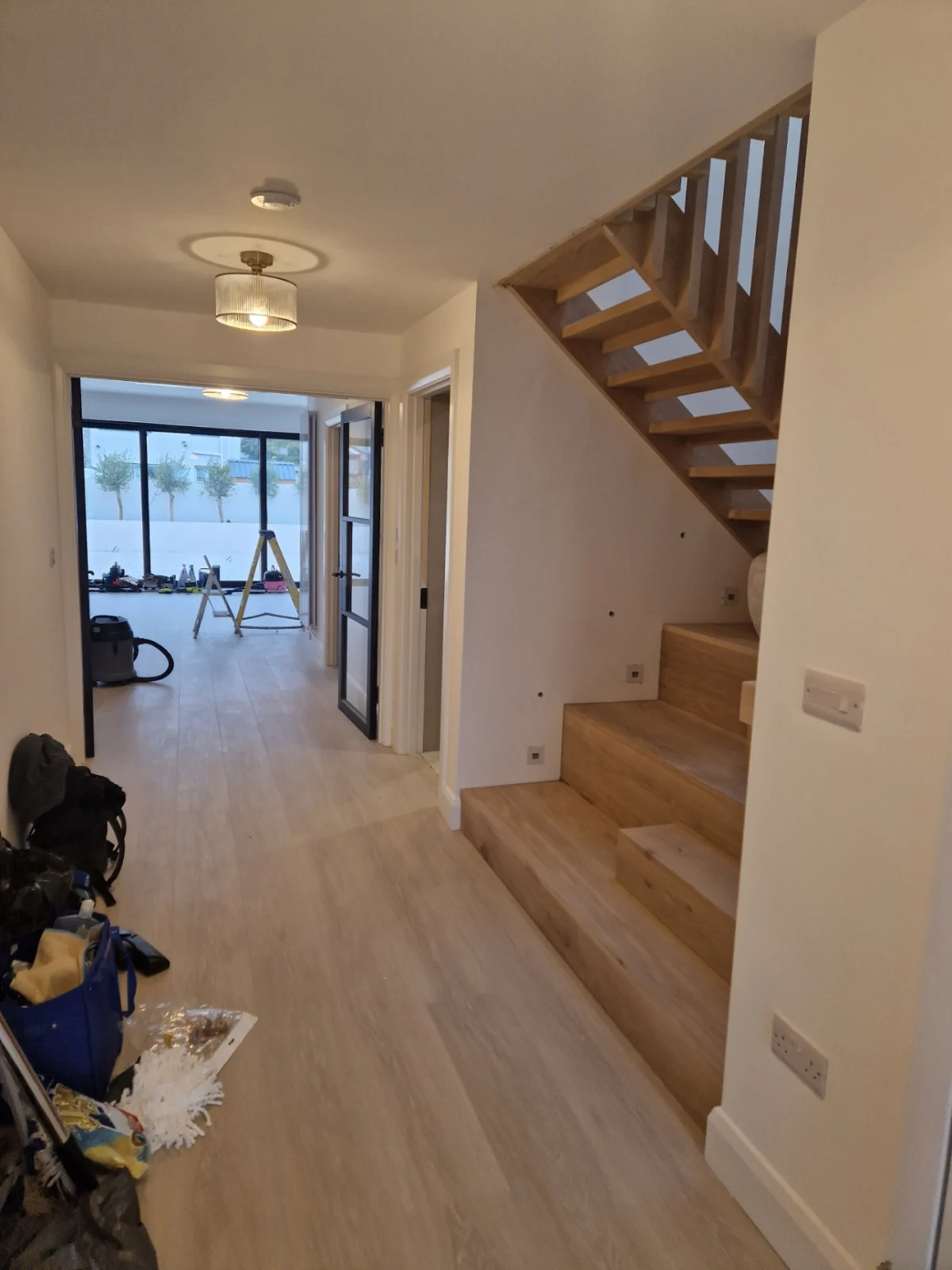 A hall floor before an after builders clean