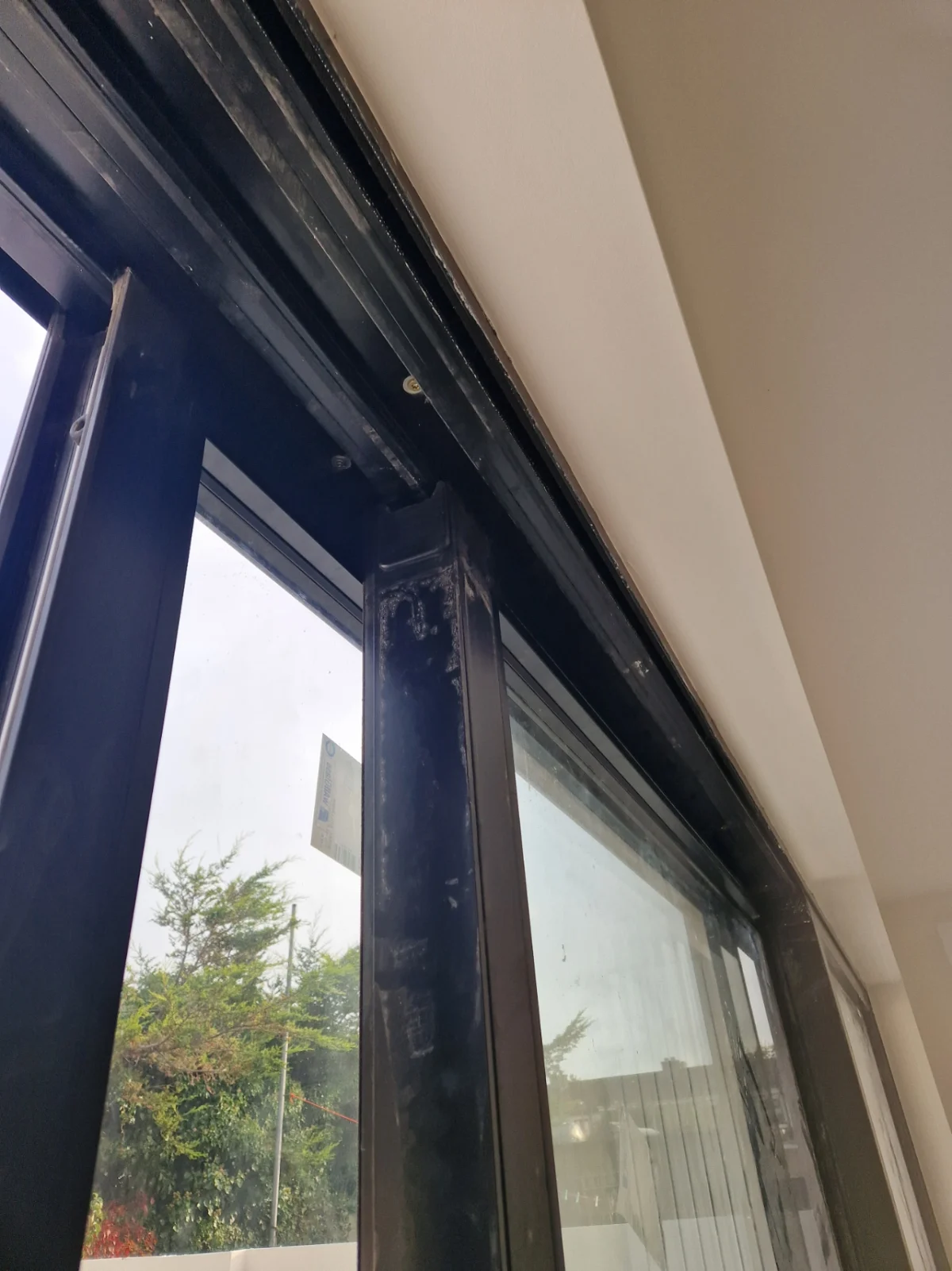 Top of a window frame before an after builders clean